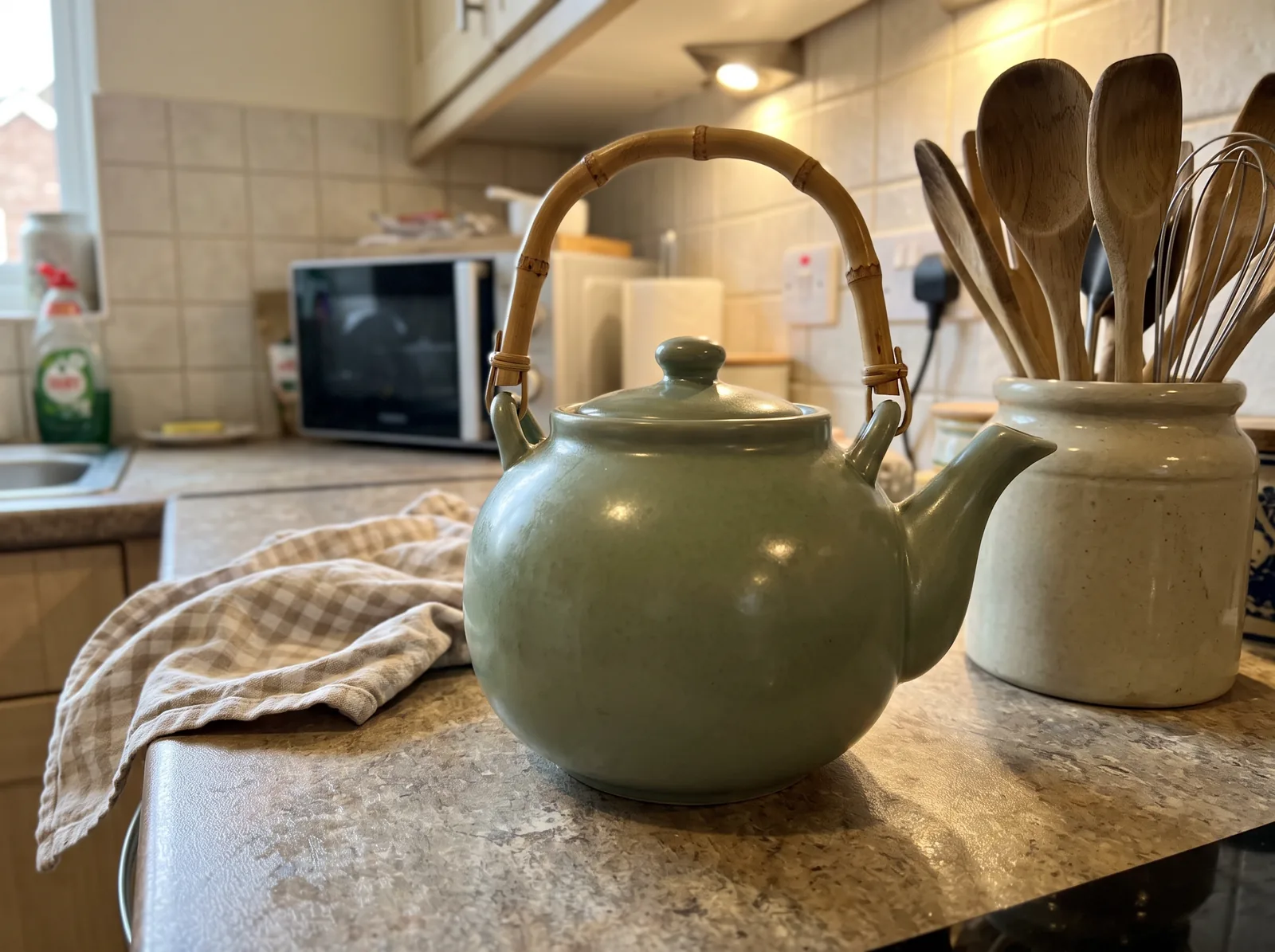 Ceramic teapot in five frames: original kitchen photo, light-gray backdrop, breakfast-table scene, new angles and an upscaled final