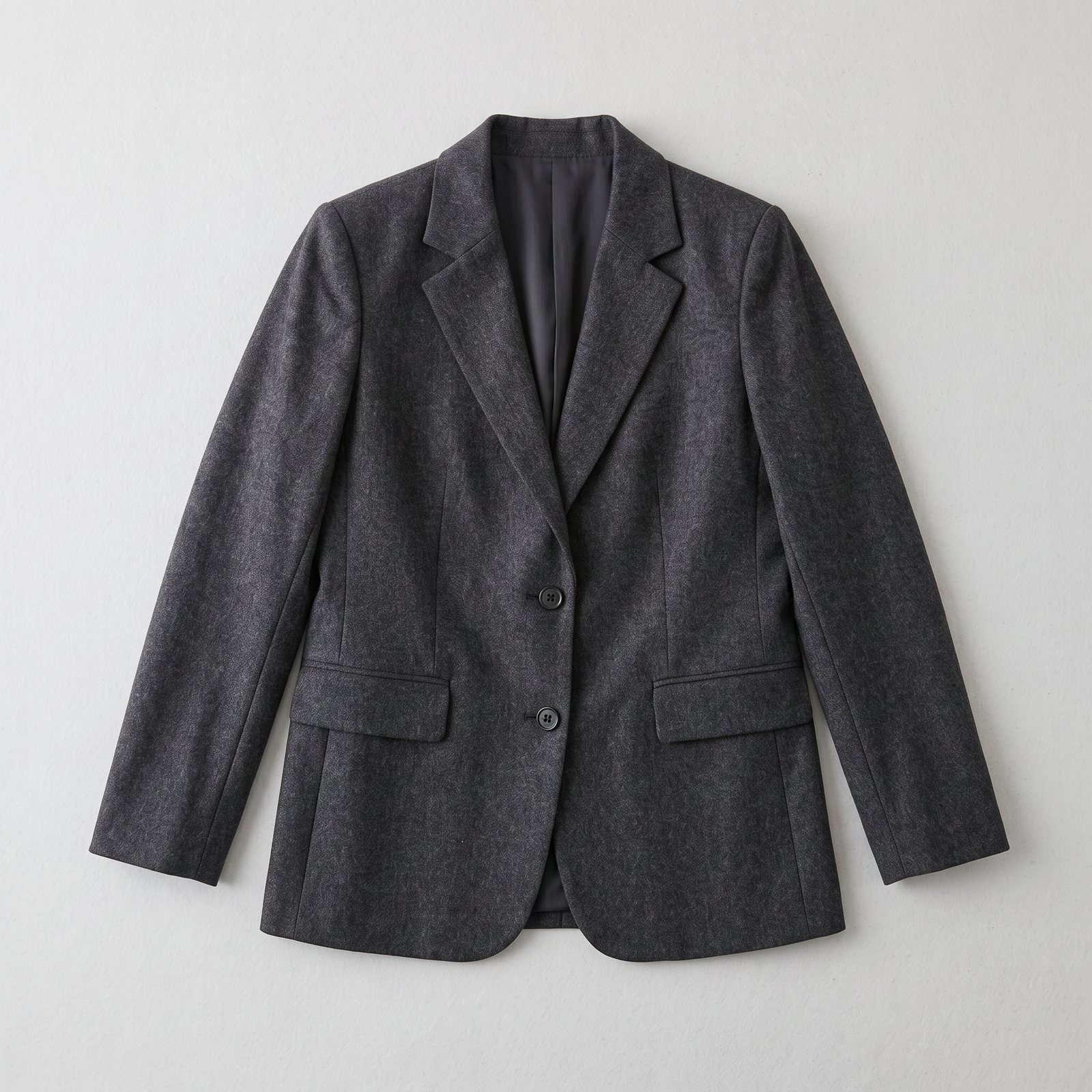 Flat-lay photo of a charcoal wool blazer